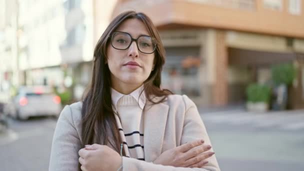 Young Beautiful Hispanic Woman Standing Serious Expression Arms Crossed Gesture — Video