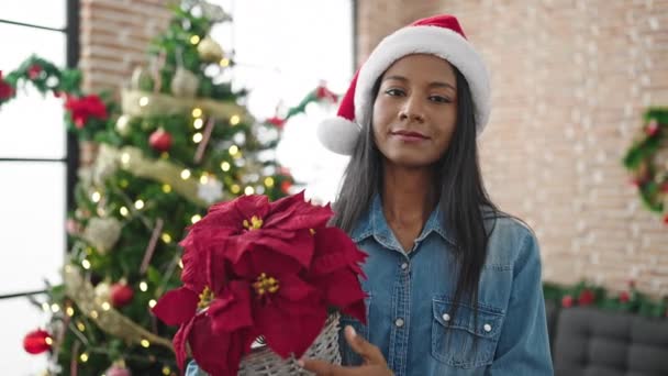 African American Woman Holding Christmas Plant Home — Stock Video