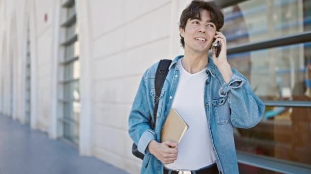 Young Hispanic Man Student Smiling Confident Talking Smartphone University — Stock Video