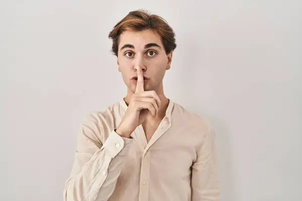 Young Man Standing Isolated Background Asking Quiet Finger Lips Silence — Fotografia de Stock