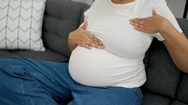 Young Pregnant Woman Examining Breast Sitting Sofa Home — Stockfoto