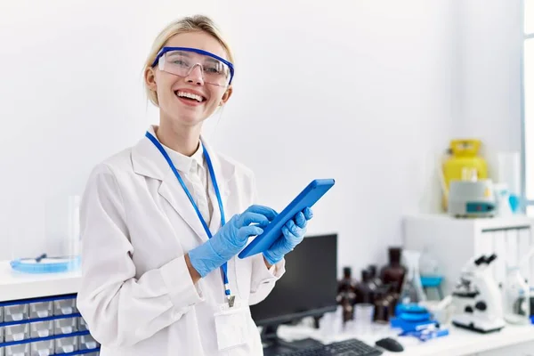 Young Blonde Woman Scientist Using Touchpad Smiling Laboratory — Stock Photo, Image