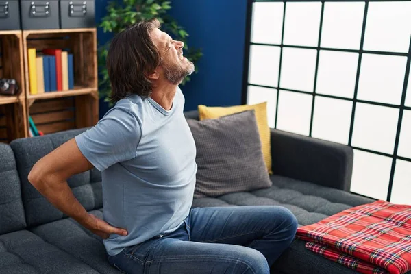 Middle Age Man Suffering Backache Sitting Sofa Home — Stok fotoğraf