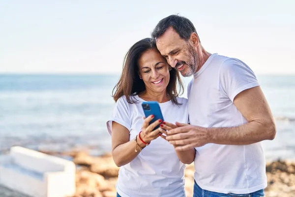 Middle Age Man Woman Couple Using Smartphone Standing Together Seaside — Stock Photo, Image