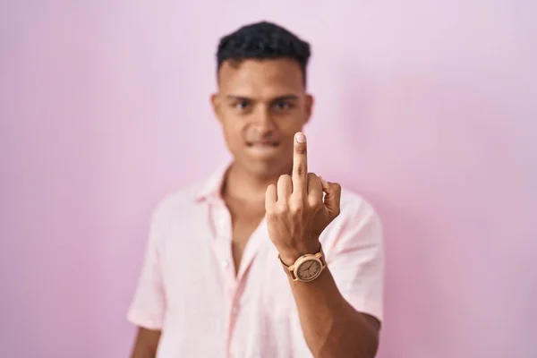 Young Hispanic Man Standing Pink Background Showing Middle Finger Impolite — Stok fotoğraf
