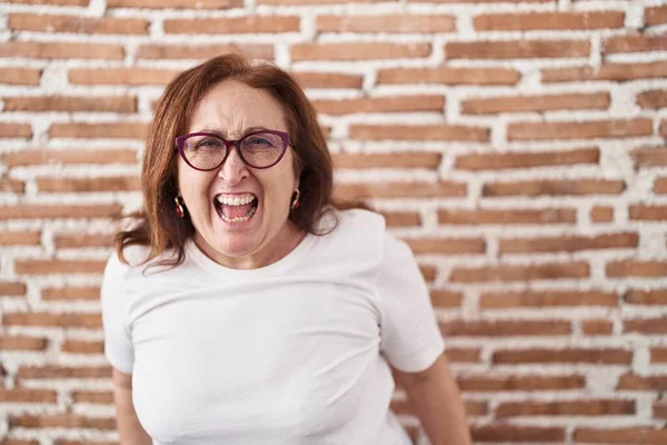 Senior Woman Glasses Standing Bricks Wall Angry Mad Screaming Frustrated — ストック写真