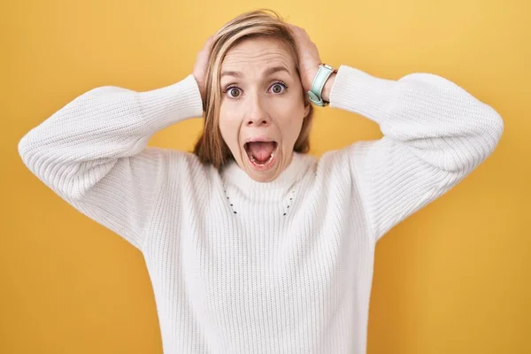 Young Caucasian Woman Wearing White Sweater Yellow Background Crazy Scared — Stock Photo, Image