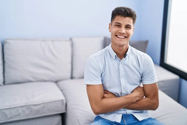 Young Hispanic Man Smiling Confident Sitting Arms Crossed Gesture Home — ストック写真