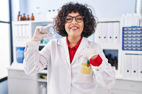 Hispanic Doctor Woman Curly Hair Holding Vaccine Pointing Finger One — Stock Photo, Image