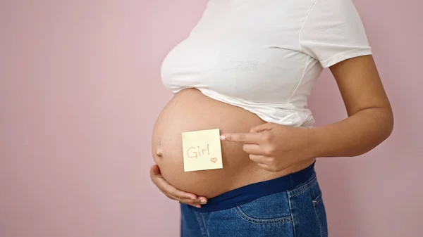 Junge Schwangere Frau Zeigt Auf Mahnpapier Auf Bauch Über Isoliertem — Stockfoto