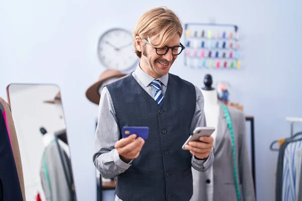 Young Blond Man Tailor Using Smartphone Credit Card Clothing Factory — Stock Photo, Image