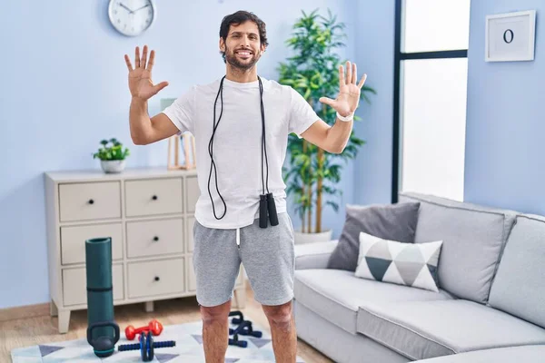 Handsome Latin Man Wearing Sportswear Home Showing Pointing Fingers Number — Stock Photo, Image