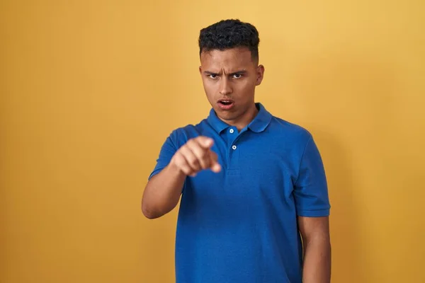 Young Hispanic Man Standing Yellow Background Pointing Displeased Frustrated Camera — Stock Photo, Image