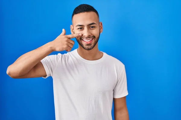 Young Hispanic Man Standing Blue Background Pointing Hand Finger Face — Stok fotoğraf