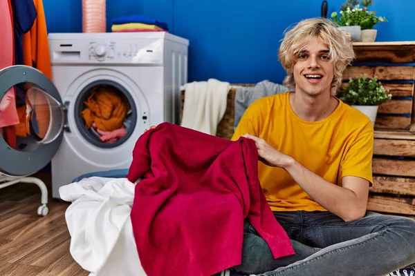 Young Blond Man Smiling Confident Washing Clothes Laundry Room — Foto Stock
