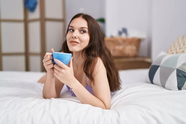 Young Woman Drinking Cup Coffee Lying Bed Bedroom — Stok fotoğraf