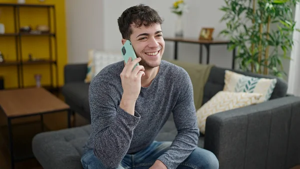 Young Hispanic Man Speaking Phone Smiling Sitting Sofa Home — Stock Photo, Image