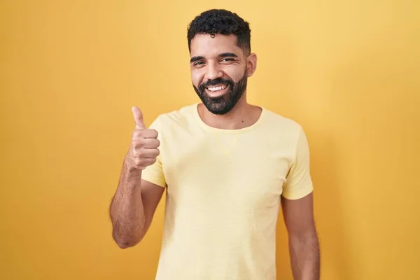 Hispanic Man Beard Standing Yellow Background Doing Happy Thumbs Gesture — 图库照片