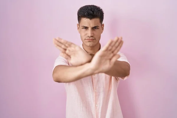 Young Hispanic Man Standing Pink Background Rejection Expression Crossing Arms — Stockfoto