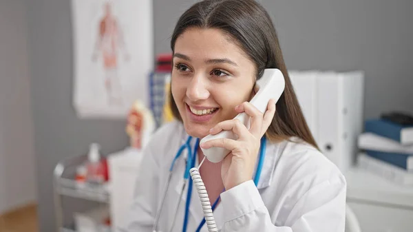 Young Beautiful Hispanic Woman Doctor Smiling Confident Talking Telephone Clinic — Stock Photo, Image