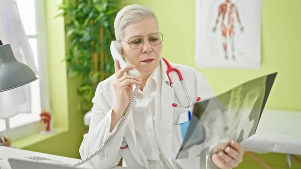 Middle Age Grey Haired Woman Doctor Talking Telephone Holding Xray — Stock Photo, Image