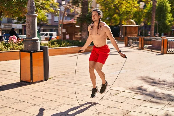 Young Man Jumping Using Rope Park —  Fotos de Stock