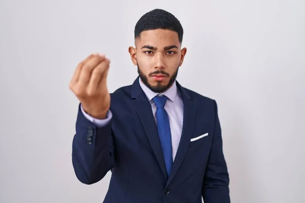 Young Hispanic Man Wearing Business Suit Tie Doing Italian Gesture — Stok fotoğraf