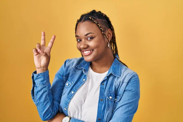 African American Woman Braids Standing Yellow Background Smiling Looking Camera — Photo