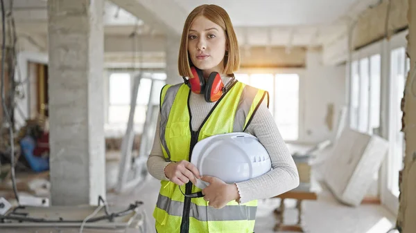 Young Blonde Woman Architect Standing Relaxed Expression Holding Hardhat Construction — Stock Photo, Image
