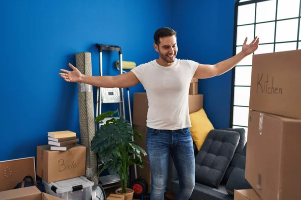 Young Hispanic Man Smiling Confident Standing Arms Open New Home — Stock Fotó