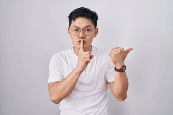 Young Asian Man Standing White Background Asking Quiet Finger Lips — Stock Photo, Image