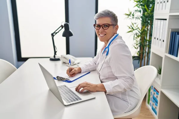 Middle Age Woman Wearing Doctor Uniform Working Clinic —  Fotos de Stock