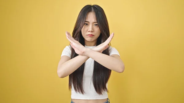 Young Chinese Woman Standing Serious Expression Crossing Arms Isolated Yellow — Stock Photo, Image