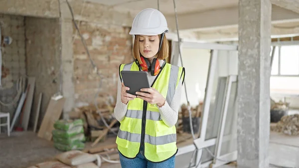 Young Blonde Woman Architect Using Touchpad Serious Expression Construction Site — Stock Photo, Image