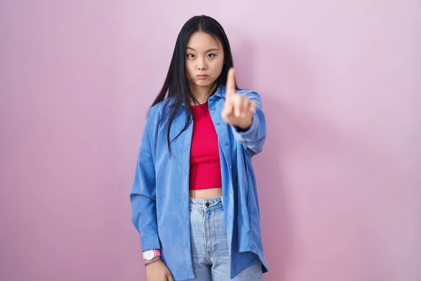 Young Asian Woman Standing Pink Background Pointing Finger Angry Expression — Zdjęcie stockowe