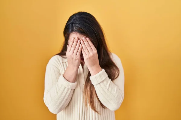 Young Hispanic Woman Standing Yellow Background Sad Expression Covering Face —  Fotos de Stock