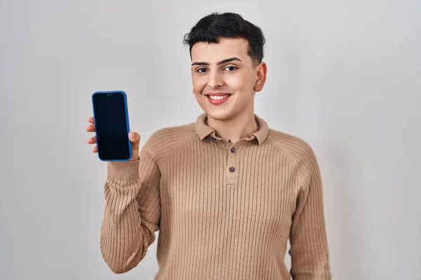 Non Binary Person Holding Smartphone Showing Blank Screen Looking Positive — Stock Photo, Image