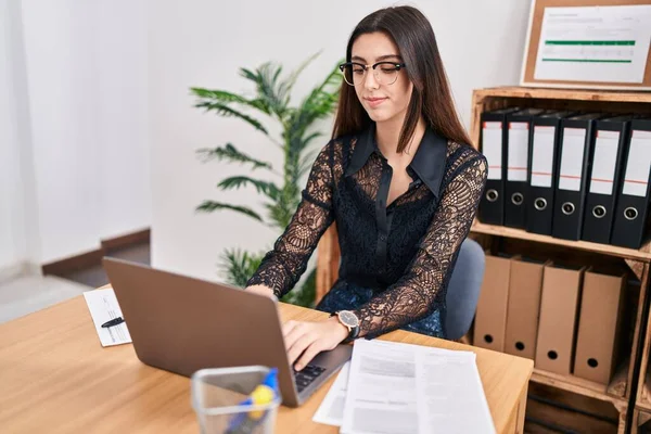 Young beautiful hispanic woman business worker using laptop working at office