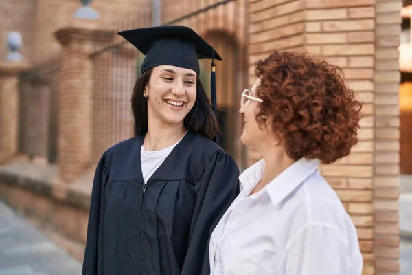 Two Women Mother Daughter Celebrating Graduation Campus University — Zdjęcie stockowe