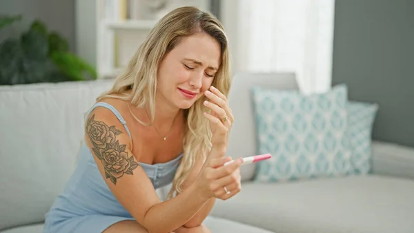 Young Blonde Woman Holding Pregnancy Test Crying Home — Stock Photo, Image