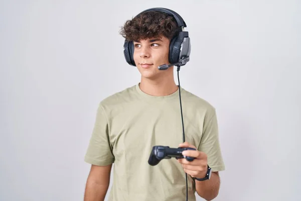 Hispanic Teenager Playing Video Game Holding Controller Smiling Looking Side — Stock Photo, Image
