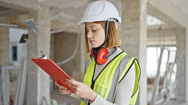 Young Blonde Woman Architect Reading Document Construction Site — Stock Photo, Image