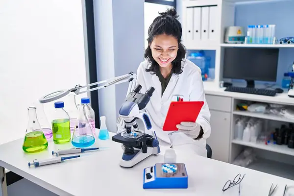 Young Latin Woman Scientist Using Microscope Touchpad Laboratory — Foto de Stock