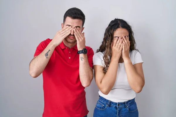 Young Hispanic Couple Standing Isolated Background Rubbing Eyes Fatigue Headache — Stock Photo, Image