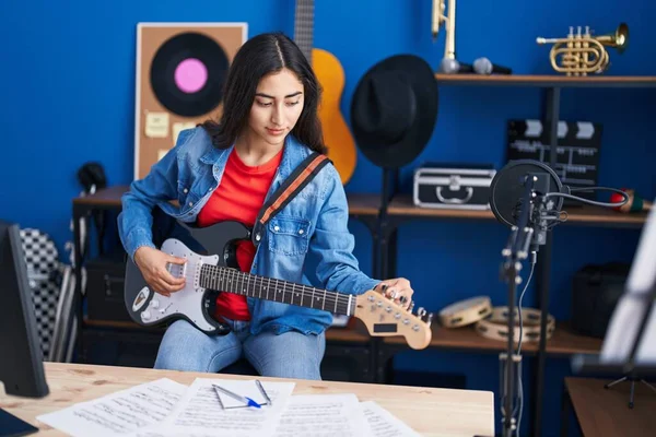 Young Hispanic Girl Artist Playing Electrical Guitar Music Studio — Stockfoto