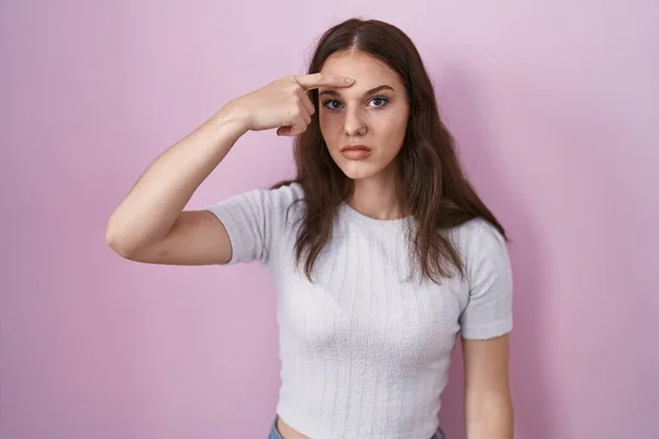 Young Hispanic Girl Standing Pink Background Pointing Unhappy Pimple Forehead — Stock Photo, Image