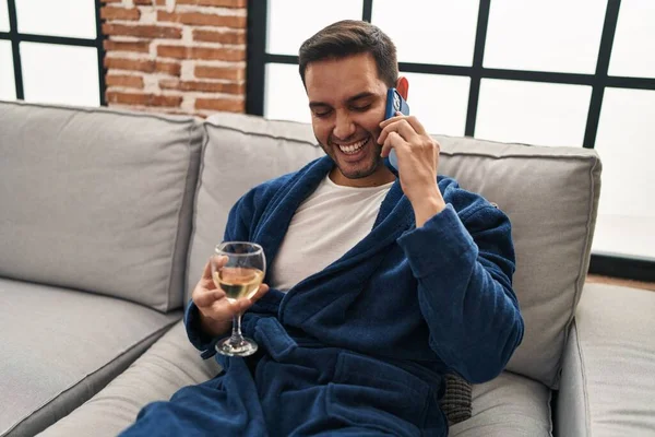 Young Hispanic Man Talking Smartphone Drinking Wine Home — Stok fotoğraf