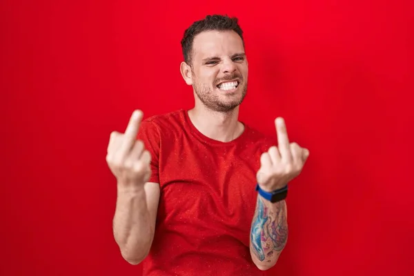 Young Hispanic Man Standing Red Background Showing Middle Finger Doing — Stockfoto