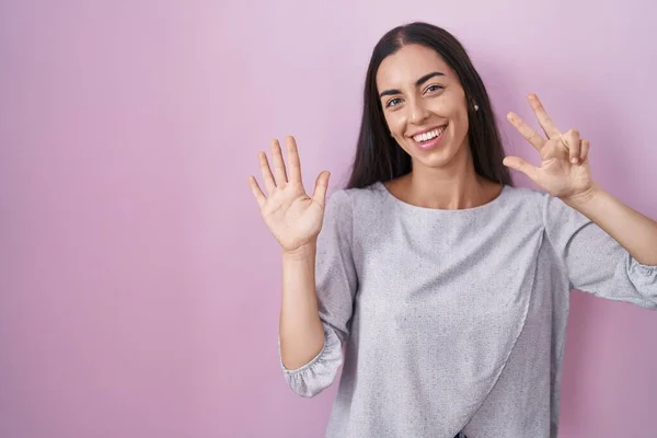 Young Brunette Woman Standing Pink Background Showing Pointing Fingers Number — Stock Photo, Image