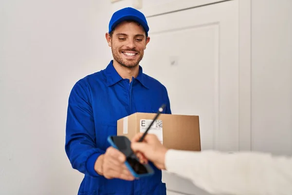 Young Hispanic Man Courier Holding Package Home — Stockfoto